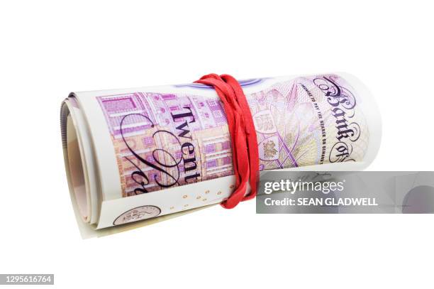 rolled up english money - twenty pound note stock pictures, royalty-free photos & images