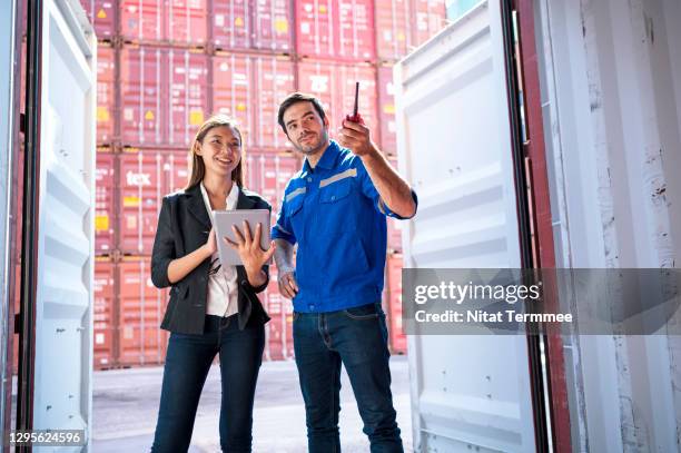 import and export customs clearance process. customs officer having discussion some product inside cargo containers.  logistic and transportation, global business concepts. - government employee stock pictures, royalty-free photos & images