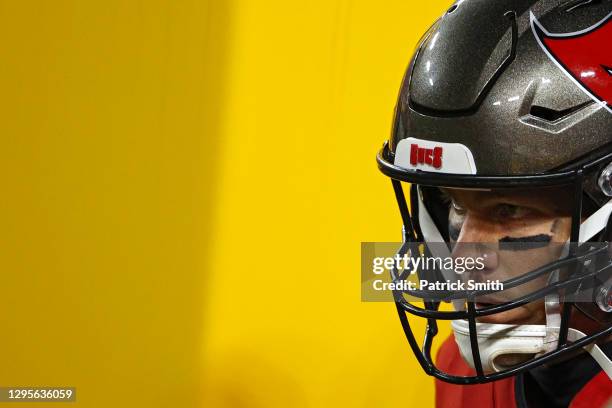 Quarterback Tom Brady of the Tampa Bay Buccaneers looks on from the tunnel before playing against the Washington Football Team at FedExField on...