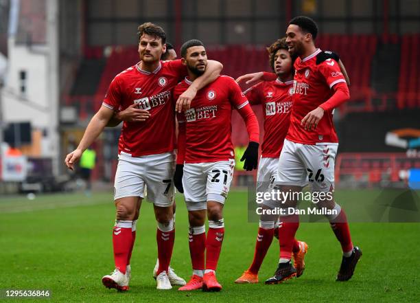 Chris Martin of Bristol City celebrates with teammates Nahki Wells, Han-Noah Massengo and Zak Vyner after scoring their team's second goal during the...
