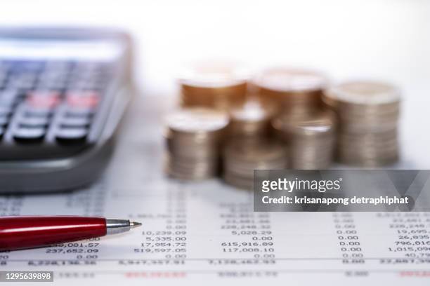 coin with calculator,account and accounting concept,money,business - bank statement ストックフォトと画像