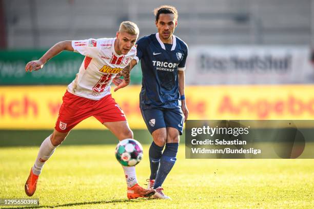 Erik Wekesser of Regensburg and Herbert Bockhorn of VfL Bochum compete for the ball during the Second Bundesliga match between SSV Jahn Regensburg...