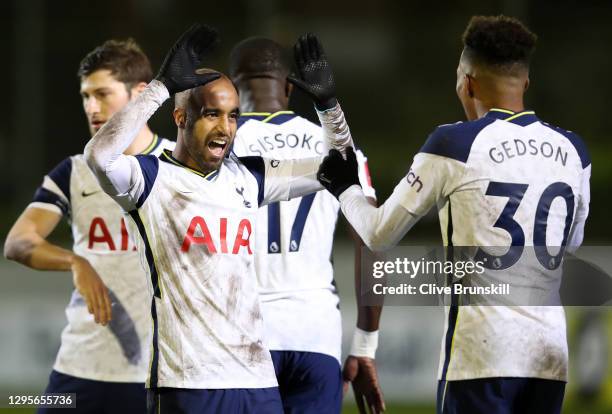 Lucas Moura of Tottenham Hotspur celebrates with teammate Gedson Fernandes after scoring their team's third goal during the FA Cup Third Round match...