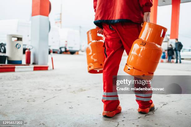 gas station work - cylinder stock pictures, royalty-free photos & images