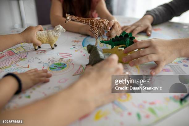 barn som leker med leksaker - toy animal bildbanksfoton och bilder