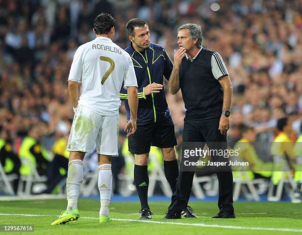 Head coach Jose Mourinho of Real Madrid instructs Cristiano Ronaldo during the UEFA Champions League group D match between Real Madrid and Olympique...