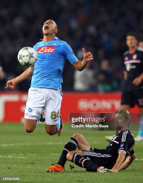 Goekhan Inler of Naples and Anatoliy Tymoshchuk of Muenchen battle for the ball during the UEFA Champions League group A match between SSC Napoli and...