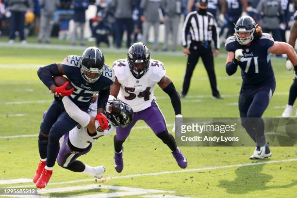 Running back Derrick Henry of the Tennessee Titans attempts to break a tackle from linebacker L.J. Fort of the Baltimore Ravens during the fourth...