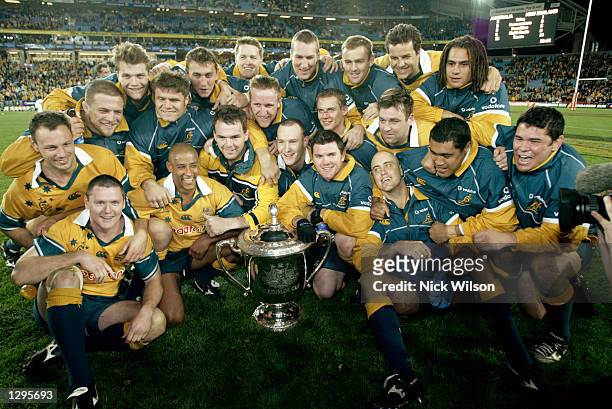 The Wallabies pose with the Bledisloe Cup after the Tri Nations Rugby Union test match between Australia and New Zealand played at Telstra Stadium in...