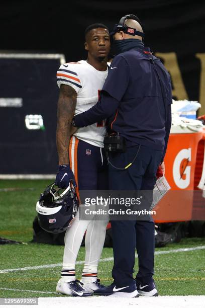 Anthony Miller of the Chicago Bears talks with head coach Matt Nagy after being ejected from the game on a penalty of Unsportsmanlike Conduct because...