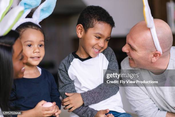 a blended family celebrate easter - easter bunny man stock pictures, royalty-free photos & images