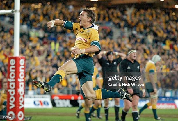 Mat Rogers of the Wallabies celebrates scoring a try in the last minutes of the Tri Nations Rugby Union test match between Australia and New Zealand...