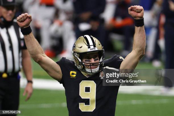 Drew Brees of the New Orleans Saints celebrates a touchdown scored by Alvin Kamara , against the Chicago Bears during the fourth quarter in the NFC...