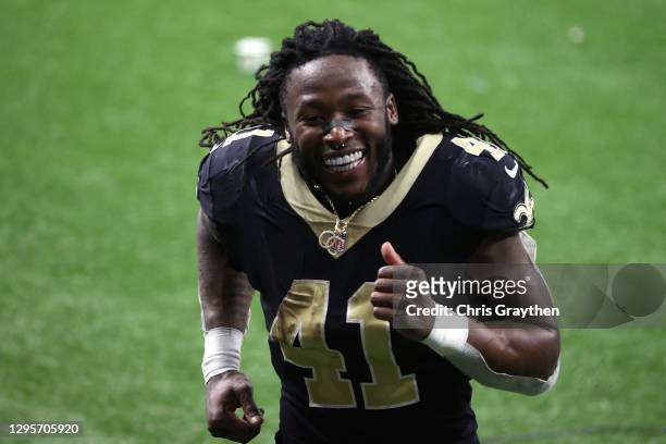 Alvin Kamara of the New Orleans Saints celebrates after defeating the Chicago Bears with a score of 21 to 9 in the NFC Wild Card Playoff game at...