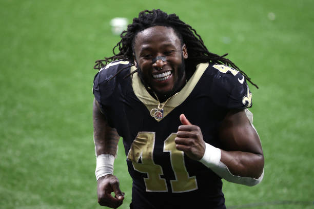 Alvin Kamara of the New Orleans Saints celebrates after defeating the Chicago Bears with a score of 21 to 9 in the NFC Wild Card Playoff game at...