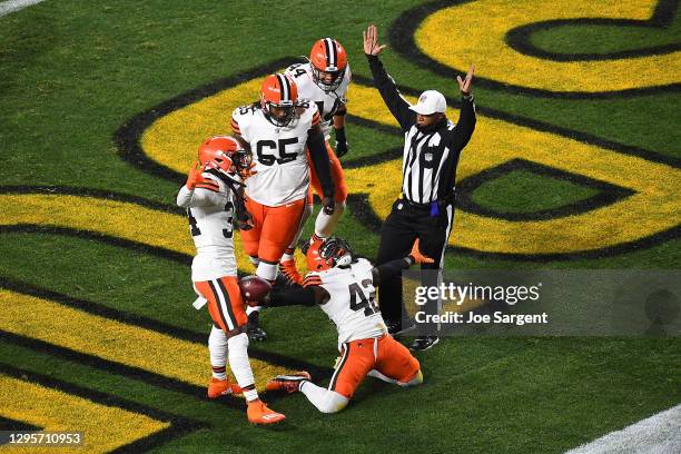 Karl Joseph of the Cleveland Browns celebrates a touchdown during the first half of the AFC Wild Card Playoff game against the Pittsburgh Steelers at...
