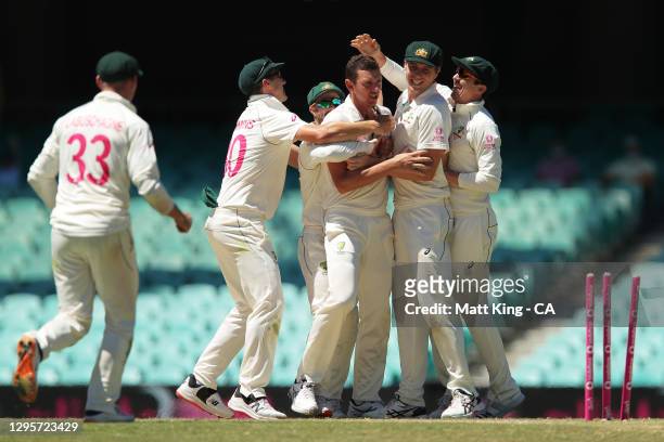 Josh Hazlewood of Australia celebrates with team mates after taking the wicket of Cheteshwar Pujara of India during day five of the Test match in the...