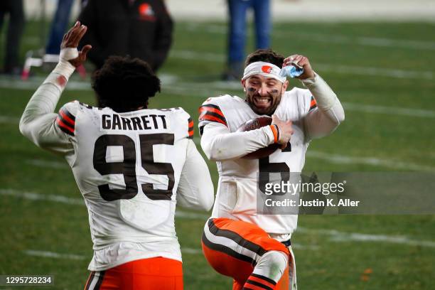 Baker Mayfield and Myles Garrett of the Cleveland Browns celebrate a victory over the Pittsburgh Steelers in the AFC Wild Card Playoff game at Heinz...