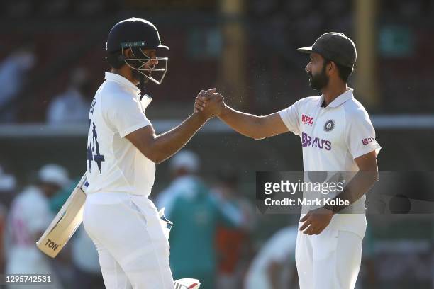 Hanuma Vihari of India shakes hands with his captain Ajinkya Rahane of India as they celebrate securing a draw during day five of the Third Test...