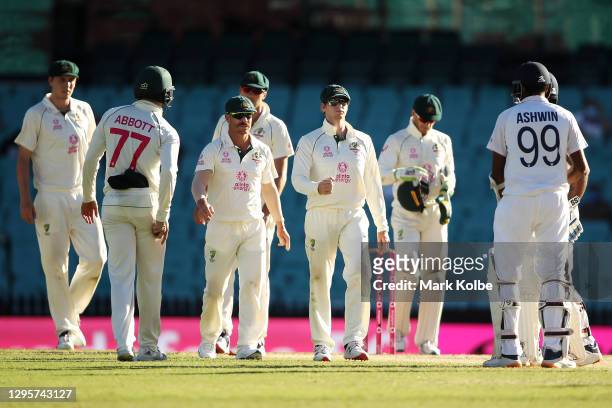 The Australia players shakle hands with Hanuma Vihari and Ravichandran Ashwin of India after a draw during day five of the Third Test match in the...