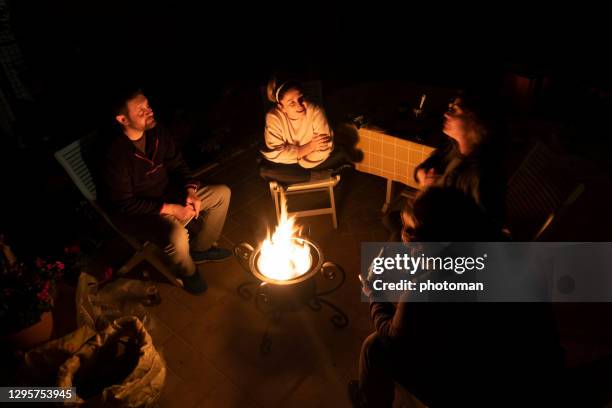 night talk with camp fire and friends. - campfire storytelling stock pictures, royalty-free photos & images