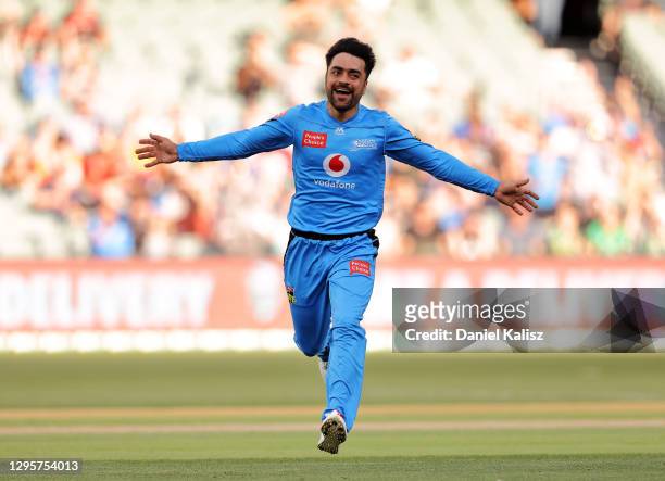 Rashid Khan of the Strikers celebrates after taking the wicket of Glenn Maxwell of the Stars during the Big Bash League match between the Adelaide...