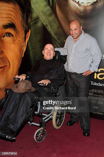 Philippe Pozzo Di Borgo and Abdel Sellou attend the Paris premiere of 'Intouchables' at Cinema Gaumont Marignan on October 18, 2011 in Paris, France.