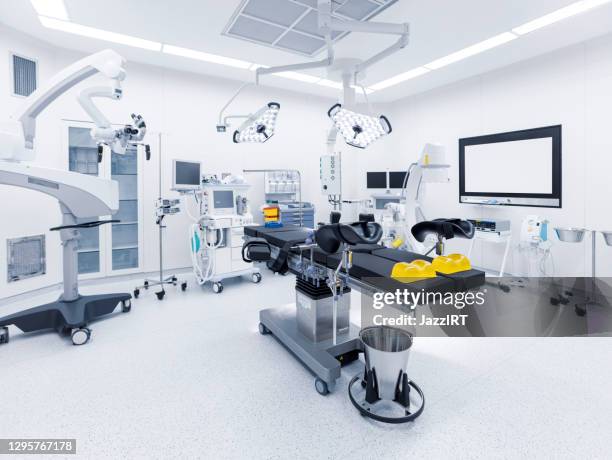 modern hospital operating room with monitors and equipment - operating theatre stock pictures, royalty-free photos & images