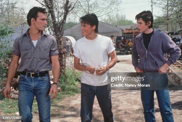 On the Set of The Outsiders - From left to right : Patrick Swayze, Rob Lowe and C. Thomas Howell.