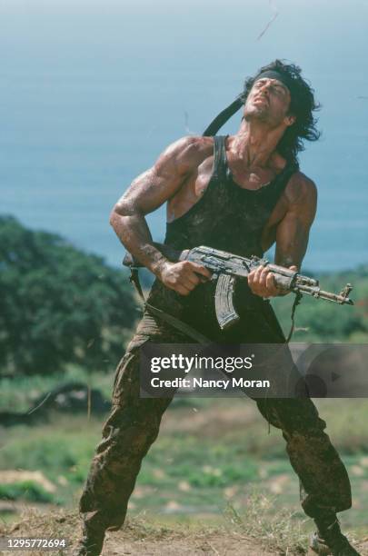 American actor, director, screenwriter and producer Sylvester Stallone on the set of Rambo: First Blood Part II, directed by Greek director George P....