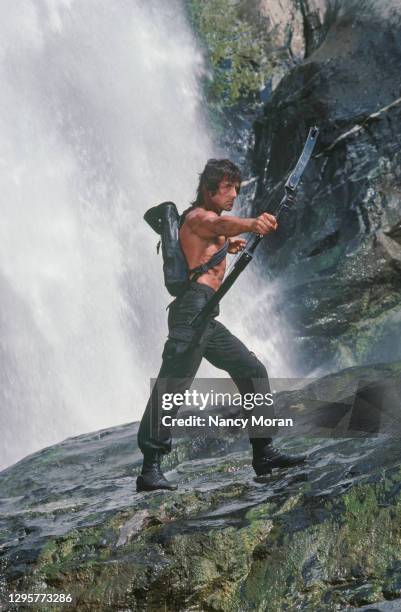 American actor, director, screenwriter and producer Sylvester Stallone on the set of Rambo: First Blood Part II, directed by Greek director George P....