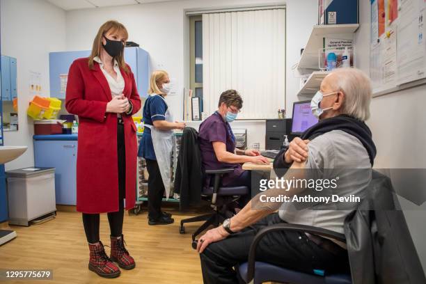 Labour's deputy leader Angela Rayner speaks with a patient after they received the Pfizer COVID-19 vaccine at a visit to a vaccination centre at the...