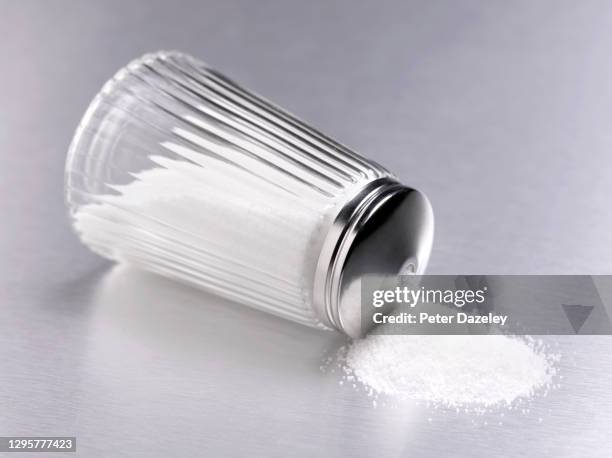 spilt sugar shaker - sugar shaker stock pictures, royalty-free photos & images