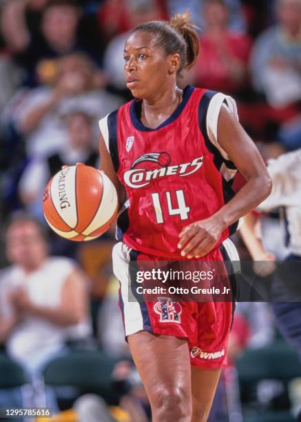 Cynthia Cooper, Guard for the Houston Comets dribbles the basketball down court during the WNBA Western Conference basketball game against the...