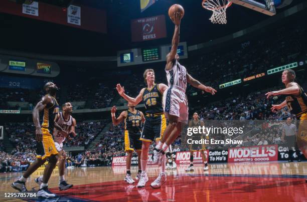 Stephon Marbury, Point Guard for the New Jersey Nets makes a one handed layup to the basket during the NBA Atlantic Division basketball game against...