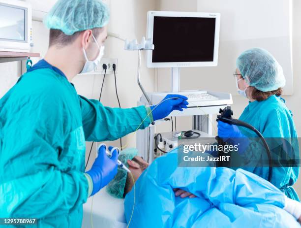 patient getting fiber-optic gastroscopy - throat exam stock pictures, royalty-free photos & images