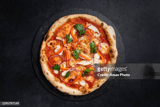 neapolitan pizza on black background - pizza ingredients stock pictures, royalty-free photos & images