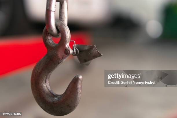 lifting the engine crane at car service. close-up. details, selective focus. copy space - car engine close up stock pictures, royalty-free photos & images