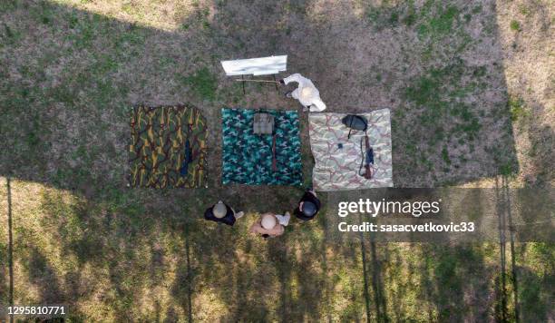 security operatives train with weapon at shooting range - kalashnikov stock pictures, royalty-free photos & images