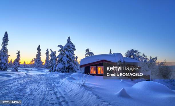 mountain cabin at dawn in january, synnfjell - oppland county norway - hut stock pictures, royalty-free photos & images