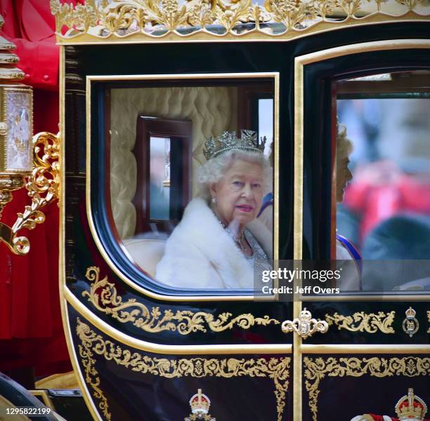 State Opening of Parliament. The carriage of Queen Elizabeth II crosses Horse Guards Parade, London, en-route to the Palace of Westminster where she...