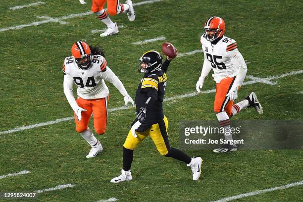 Ben Roethlisberger of the Pittsburgh Steelers is pressured by Adrian Clayborn of the Cleveland Browns at Heinz Field on January 10, 2021 in...