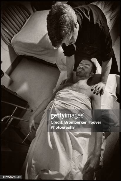 Overheard view of Bailey-Boushay House AIDS patient Edward Baxter as he receives a massage , Seattle, Washington, 1993. Describing how the massage...