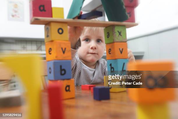 children playing with building blocks - 1 2 finale stock pictures, royalty-free photos & images