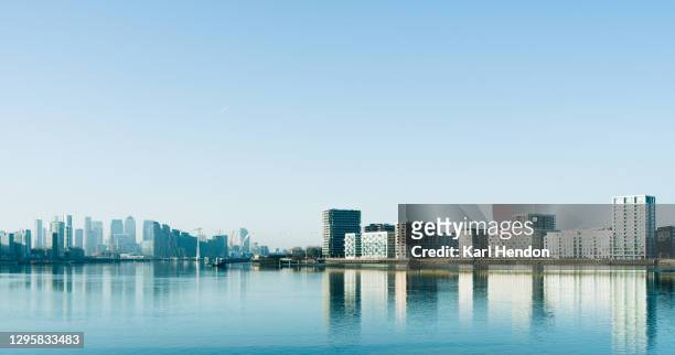 a daytime view of the london skyline - stock photo - sunset on canary wharf stock pictures, royalty-free photos & images