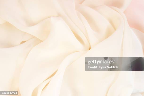 smooth elegant golden silk or satin luxury cloth texture background. - champagne salon stock-fotos und bilder