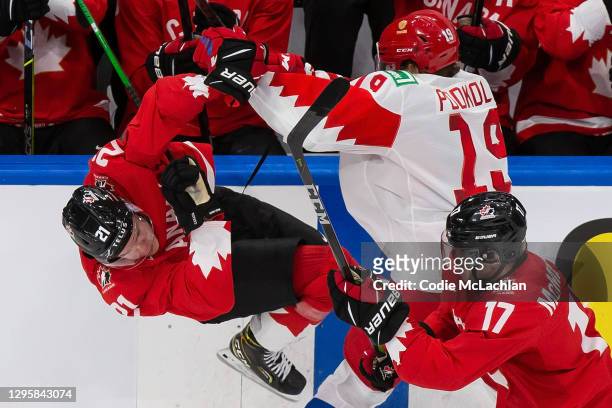 Kaiden Guhle of Canada skates against Vasili Podkolzin of Russia during the 2021 IIHF World Junior Championship semifinals at Rogers Place on January...
