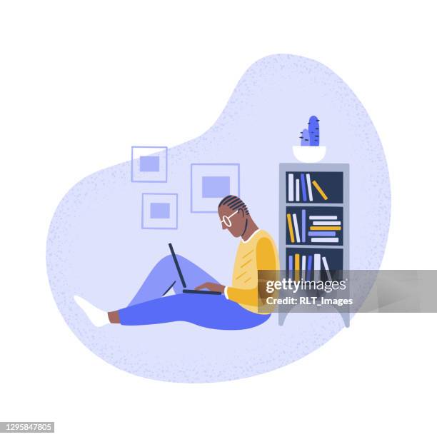 illustration of young man using laptop at home - teleworking stock illustrations