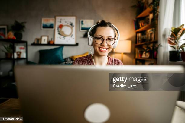 smiling young woman teaching online. - online class stockfoto's en -beelden