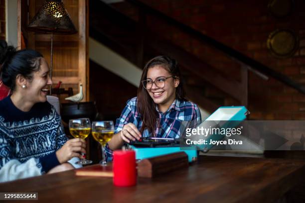 friends listening to vinyl record in the room - images royalty free stock pictures, royalty-free photos & images
